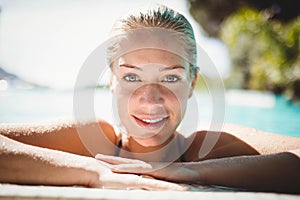 Portrait of beautiful blonde in the pool