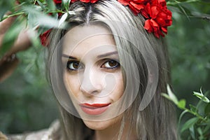 Portrait of a beautiful blonde woman in the flower crown