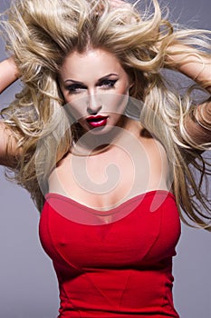 Portrait of beautiful blonde woman with red lips