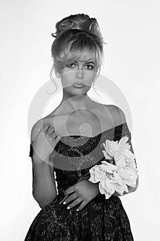 Portrait of a beautiful blonde woman in retro dress 50-s style . monochrome black and white photo