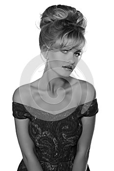 Portrait of a beautiful blonde woman in retro dress 50-s style . monochrome black and white photo
