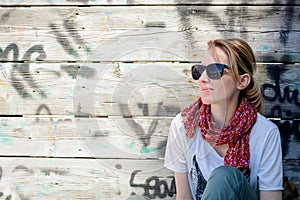 Portrait of a beautiful blonde woman standing and posing outdoor