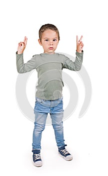 Portrait of beautiful boy giving you thumbs up over white background