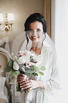 Portrait of beautiful bride with bouquet