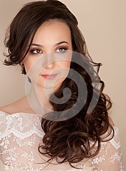 Portrait of beautiful bride with hairstyle and makeup