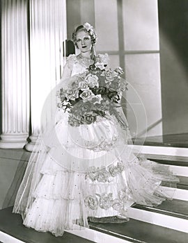 Portrait of beautiful bride holding bouquet