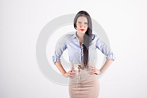 Portrait of beautiful brunette business woman posing in studio i