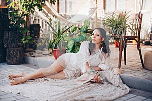 Portrait of beautiful brunette girl in boho style