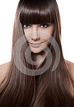 Portrait of a beautiful brunette woman with long straight hair