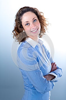 Portrait of a beautiful business woman on light backg