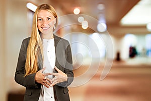 Portrait of beautiful business woman standing in office