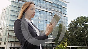 Portrait of Beautiful Business Woman Using Tablet PC Outside Business Center