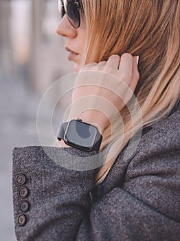 Portrait of beautiful business woman wearing in digital smart watch