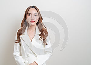 Portrait beautiful business woman in white dress suit