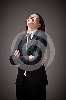 Portrait of a beautiful businesswoman with black suit and tie