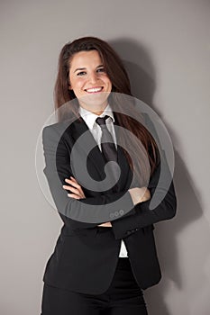 Portrait of a beautiful businesswoman with black suit and tie