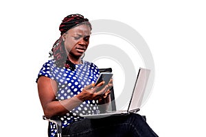 Portrait of a beautiful businesswoman reading message on cellphone, unhappy