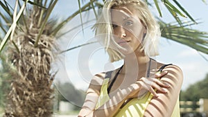 Portrait of beautiful caucasian girl posing on tropical beach.