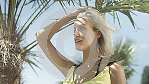 Portrait of beautiful caucasian girl posing on tropical beach.