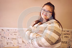 Portrait of beautiful chubby caucasian woman with arms crossed