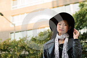 Portrait of a beautiful classy asian woman in hat