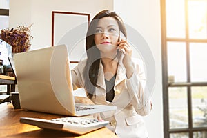 Portrait of beautiful and confident Asian business woman in work