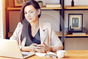 Portrait of beautiful and confident Asian business woman in working age using computer laptop technology