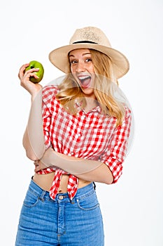 Portrait of beautiful country girl with apple over white background.