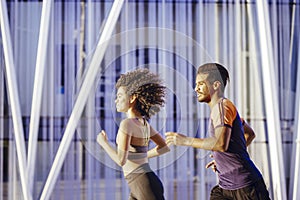 Portrait of a beautiful couple running together