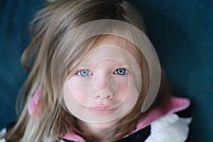 Portrait of beautiful cute little girl with blue eye