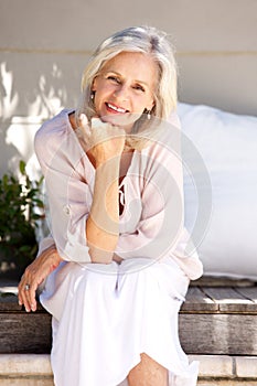 Beautiful elderly woman smiling outside