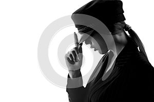 Portrait of a beautiful elegant girl in a beret and suit. Black and white photo