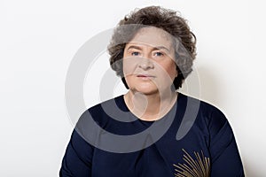 Portrait of beautiful elegant woman in a well-kept older srudii on a white background with makeup and without makeup