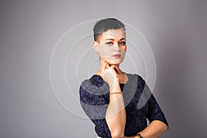 Portrait of a beautiful elegant young woman. Girl with short cut hairstyle.