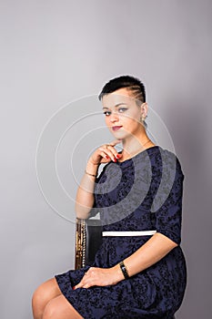 Portrait of a beautiful elegant young woman. Girl with short cut hairstyle.