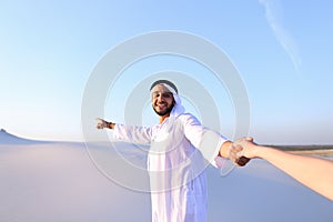 Portrait of beautiful Emirate male tourist guide, who holds woma