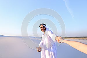 Portrait of beautiful Emirate male tourist guide, who holds woma