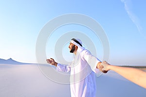 Portrait of beautiful Emirate male tourist guide, who holds woma