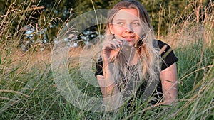 Portrait of a beautiful European girl with loose hair against the background of nature. selective focus