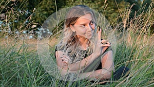 Portrait of a beautiful European girl with loose hair against the background of nature. selective focus