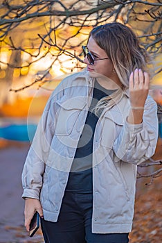 Portrait of a beautiful European girl with loose hair against the background of nature. selective focus