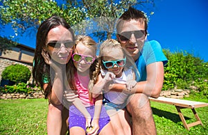 Portrait of beautiful family of four on tropical