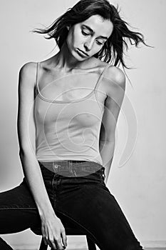 Portrait of beautiful fashion model posing over gray background.