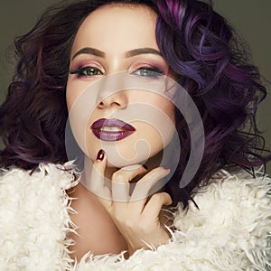 Portrait of beautiful fashion model with purple hair over g