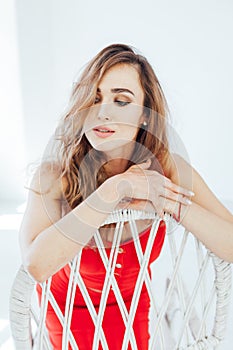 Portrait of a beautiful fashionable woman in red dress style clothing