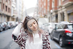 Portrait of beautiful fasuion young woman in the street.