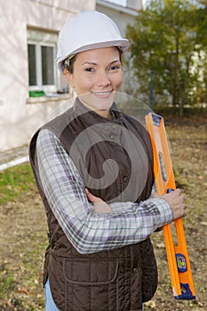 Portrait beautiful female architect at construction site