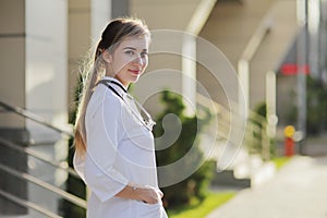 Portrait of a beautiful female doctor or nurse. Health concept