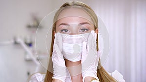 Portrait of a beautiful female doctor or nurse in medical mask