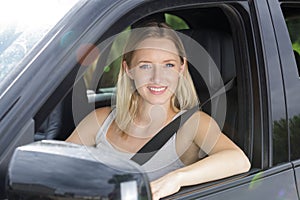 Portrait beautiful female driver behind wheel